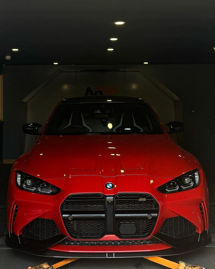 Red BMW M3 on the rolling road