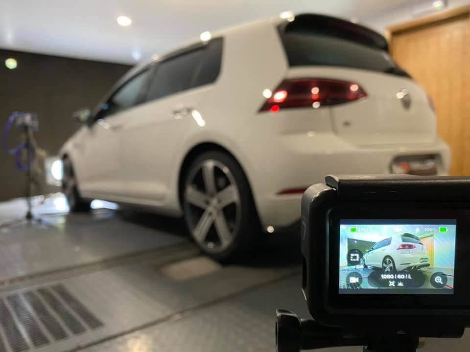 White VW Golf R on the rolling road being filmed