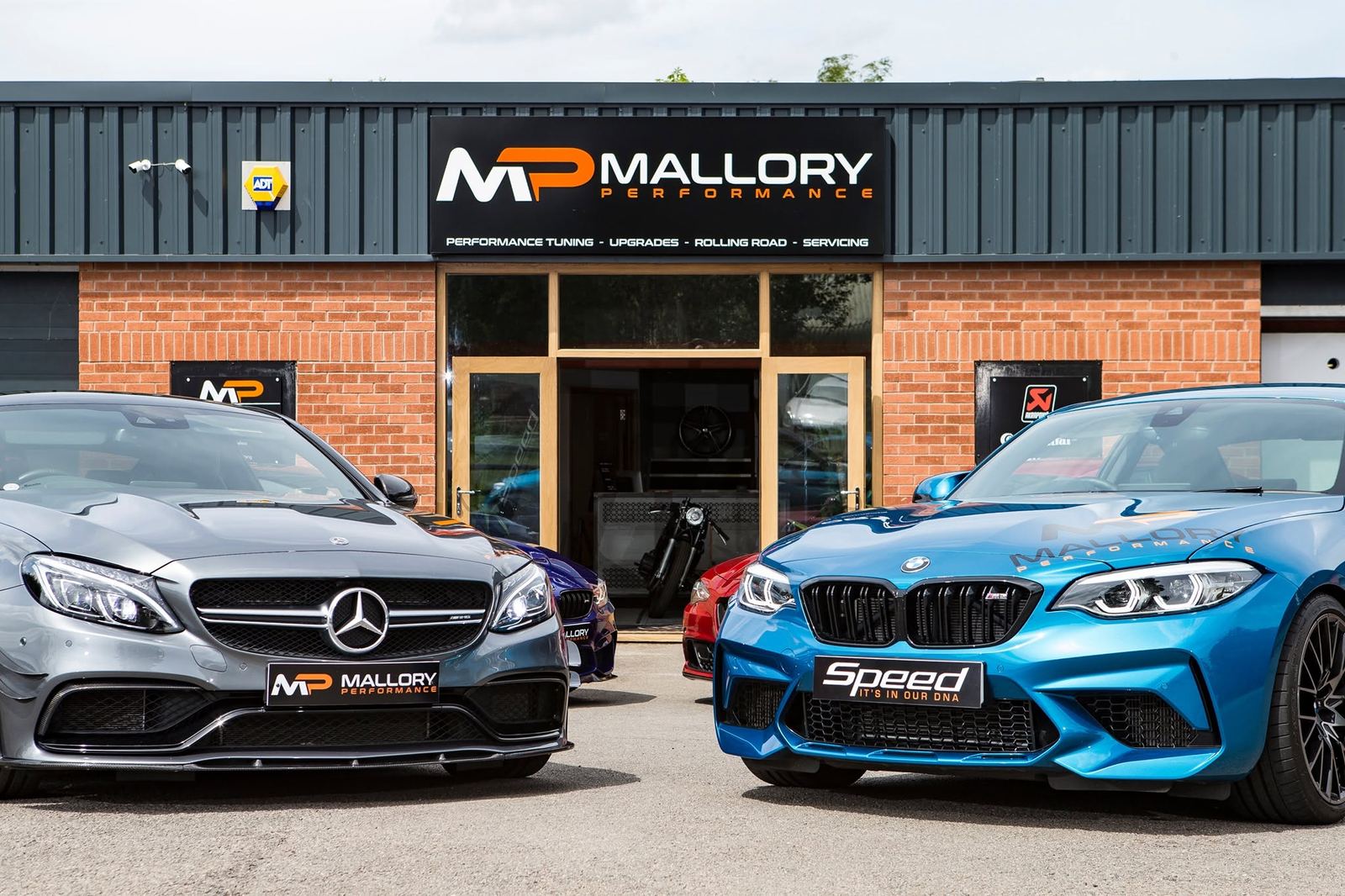 Mallory Performance workshop at Mallory Park with a Mercedes-AMG C63 and BMW M2 outside